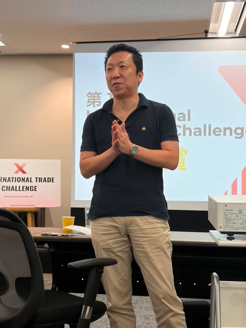 A guest speaker addressing students at the International Economix Challenge