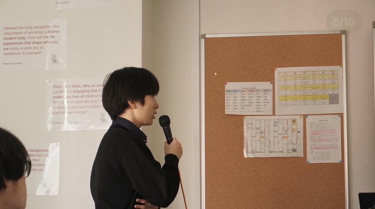 A student presenting an idea to fellow students